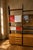 A large vintage modular wall unit with a strong architectural presence and a flexible storage layout. The contrast between...