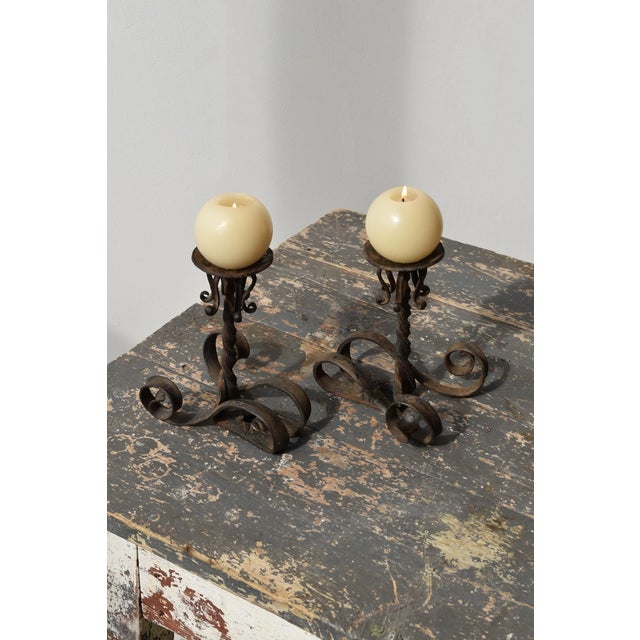 Vintage Wrought Iron Scrolling Candleholders, A Pair, Circa Mid-20th Century. Constructed from wrought iron with spiraling...