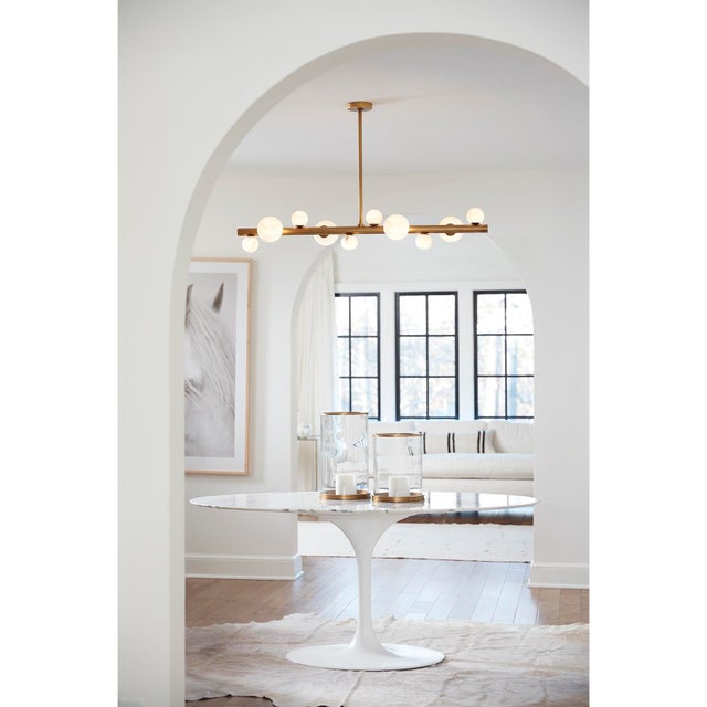 Natural alabaster stone orbs dance around a metal base, adding a spectacular sculptural element to your home. The Styx...