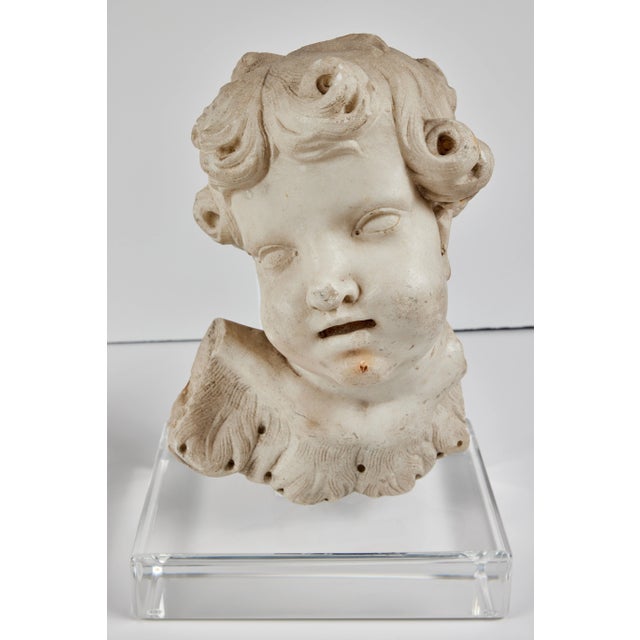 A pair of rare, early 1700’s, Roman, beautifully hand–carved, solid Carrara marble cherubim singing in adoration. Each...