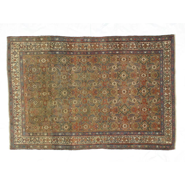 This masterpiece is a wool pile genuine handwoven antique Persian Ferahan in excellent condition. The rug was made in the...