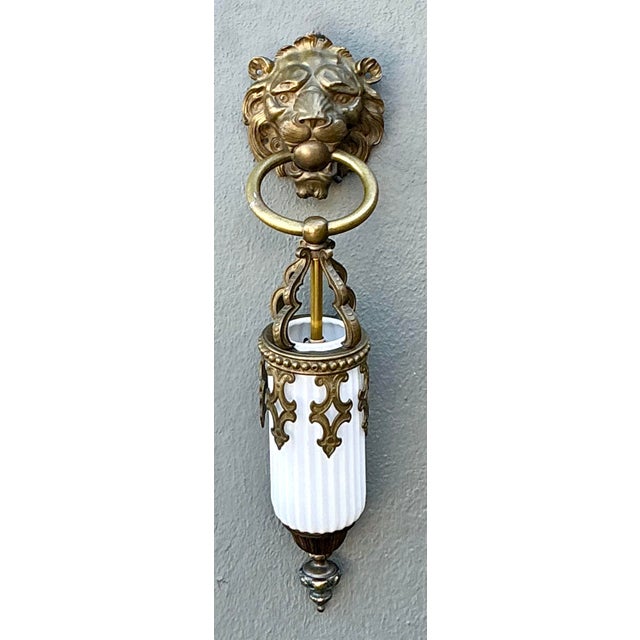 This striking vintage wall sconce is a masterful blend of Hollywood Regency glamour and Gothic Revival theatricality. The...