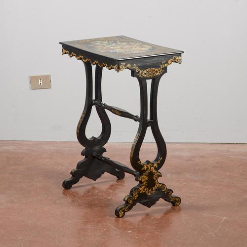 This elegant coffee table is an antique piece that captures the essence of a decorative period piece, likely referencing...