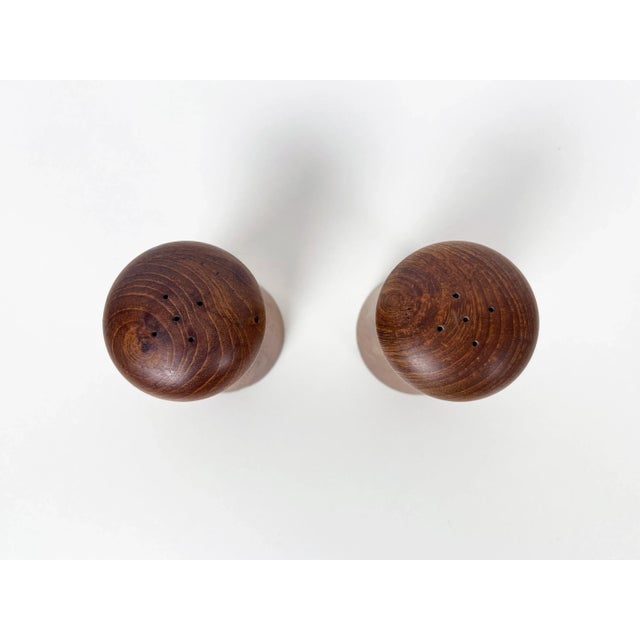 Pair of vintage mushroom shaped Danish Modern salt and pepper shakers in solid teak wood. Origin: Denmark Year: 1960s...
