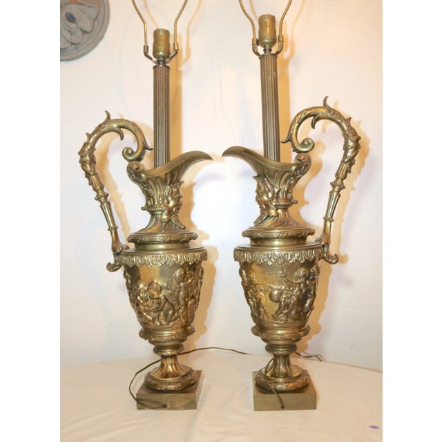 Up for sale is a very large pair of antique 19th century converted ewer electric table lamps. They're cast out of...