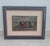 A highly atmospheric early 20th-century oil painting signed v. Irolli, depicting figures walking along a coastal promenade...