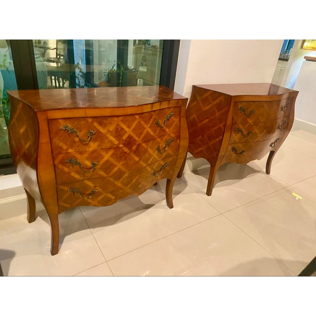 Elegant matching commodes in richly figured burl walnut with honey-toned diamond trellis inlay across the fronts, sides,...