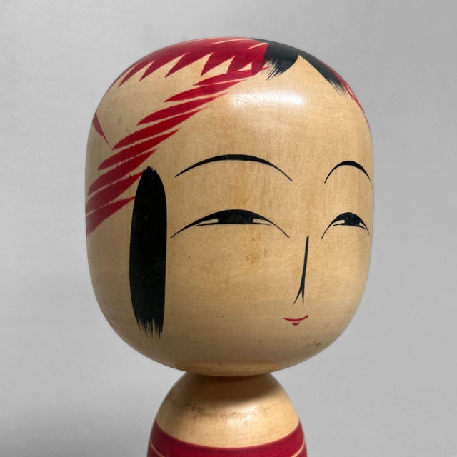 Large traditional Kokeshi doll from the Togatta family, crafted by Konno Kashiku (今野かし) from Zao, Miyagi Prefecture. The...