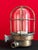 Vintage industrial lamp with an authentic character, crafted with a brass-colored metal body, a thick, bell-shaped glass...