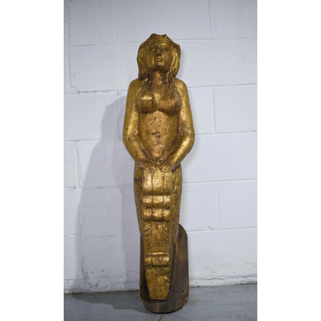 This authentic vintage carved wooden figurehead features intricate details of an iconic mermaid from the bow of a boat....