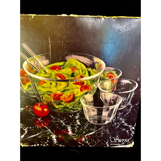 The Toscany Collection Sierra is a seven piece glass salad bowl paired with four individual matching bowls plus two...