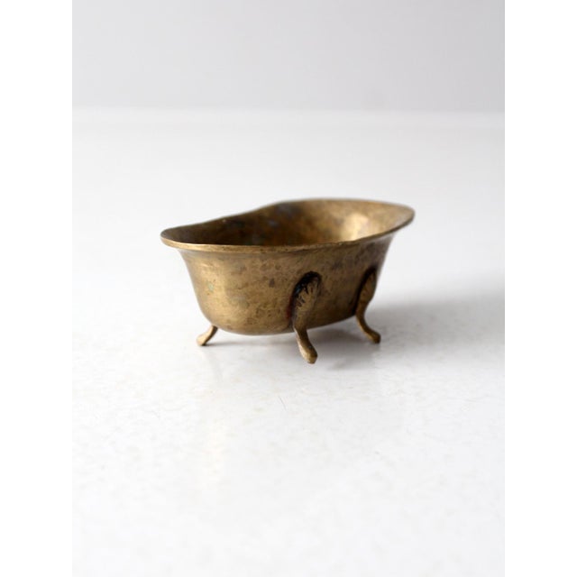 This vintage brass soap dish is shaped like a claw foot bathtub and can double as a stylish business card holder or desk...