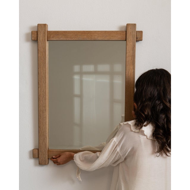 Carved oak window-pane mirror in Weathered Honey Oak. The weathered honey oak surface highlights mullioned glass panes,...