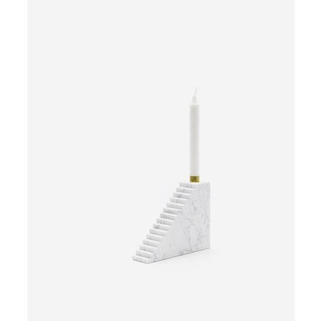 This candleholder is made of Carrara marble.