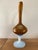 Hot-blown glass pitcher. Amber glass for the body and neck. White opaline glass for the handle and foot. Gold trim around...