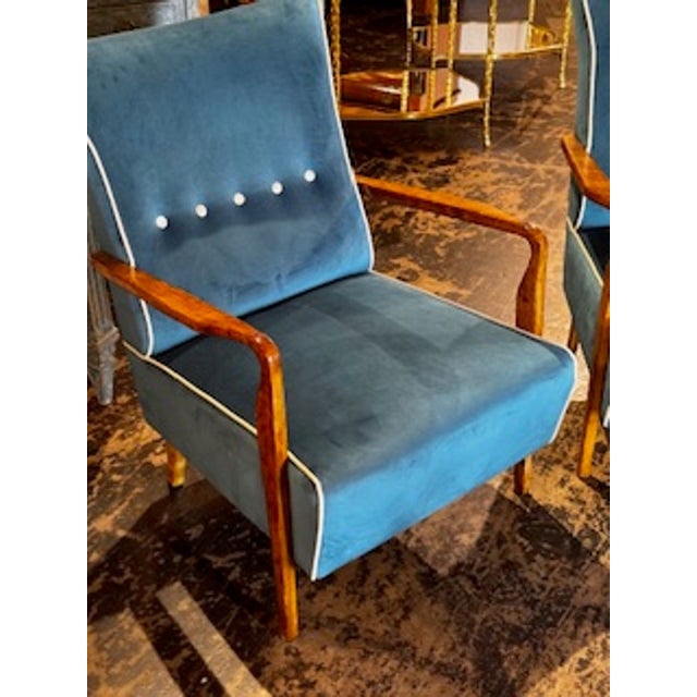 These Italian designer mid-century walnut armchairs feature a polished finish, and beautiful upholstery adding a touch of...