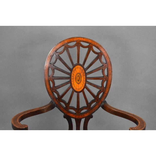 Antique Edwardian Mahogany Armchair with Inlaid Wheel Back – c.1900 Step into timeless elegance with this exquisite...