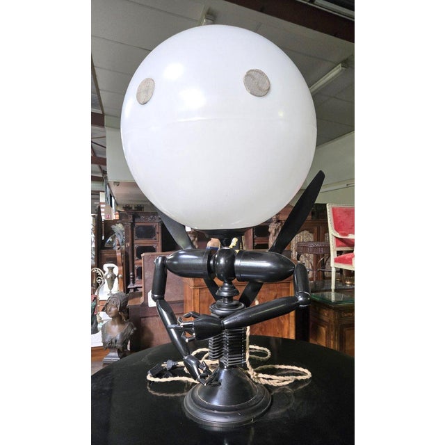 Unusual modernist thermoformed lamp by Mister Babache Depicts a robot man Up to 250V (Europe/UK Standard).The wiring of...
