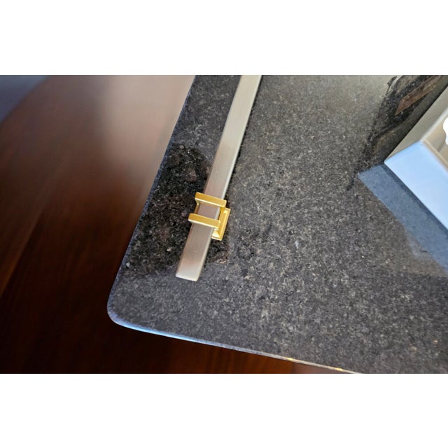 Elegant black stone serving platter paired with a matching 3-piece cheese knife set. The platter features satin nickel...