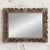 A beautifully carved French antique mirror inspired by the rich decorative traditions of the Louis XIV Baroque period. The...