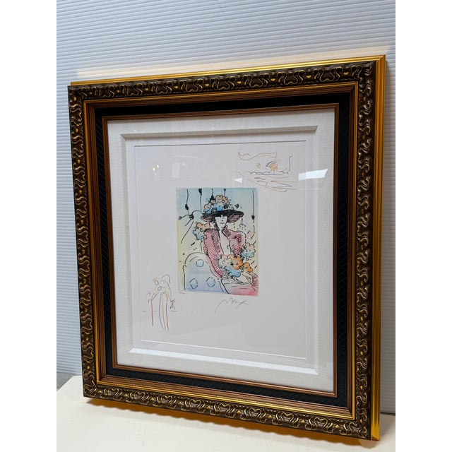 Design Plus Gallery presents a Circa 2017 Peter Max Brown Lady (Angel with Heart/Sailboat) Etching with hand-coloring and...