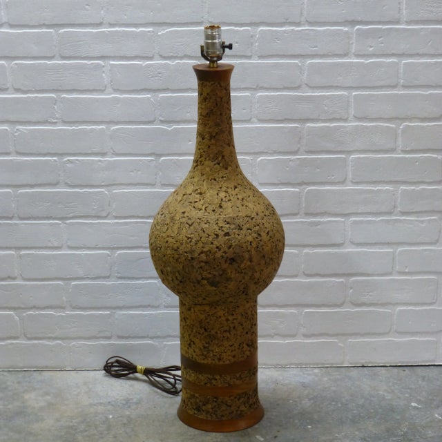 Monumental 1960s tall cork and walnut lamp. Curvy walnut stain neck, and base, with a huge cork body in-between as well as...