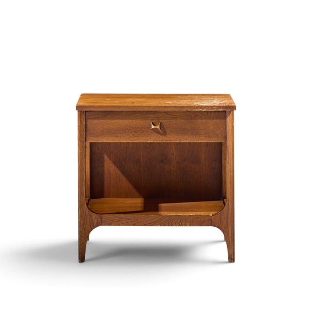 Broyhill Brasilia Mid Century Walnut and Brass Nightstand This nightstand measures: 22.25 wide x 15 deep x 22 inches high...