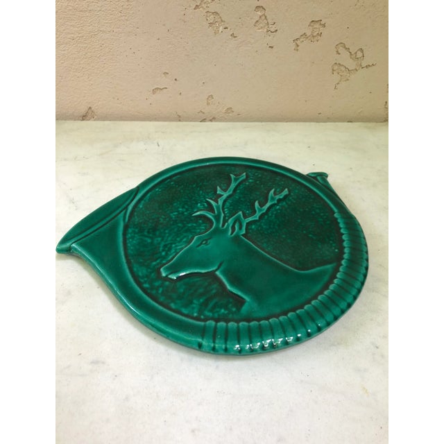 Mid-century French Green Majolica deer Trivet Vallauris. Shaped as an hunting horn.