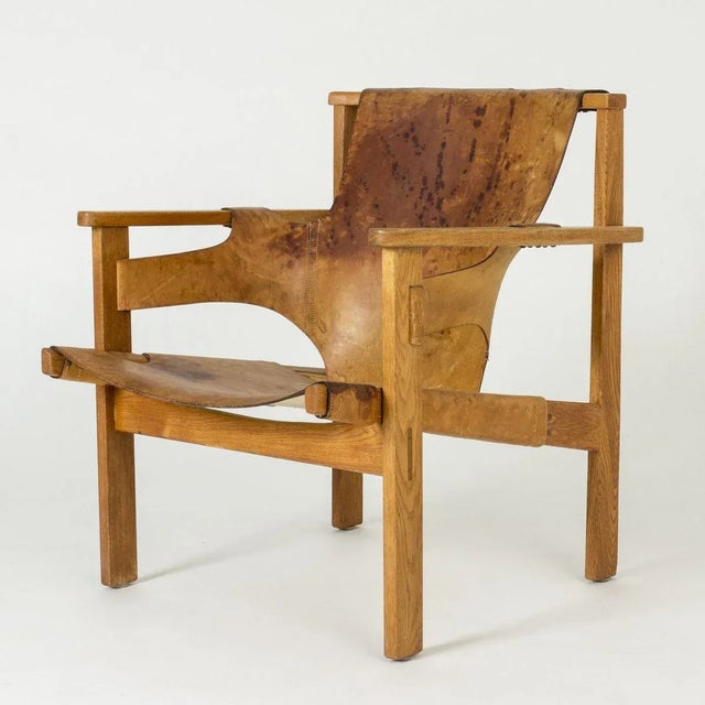 Trienna lounge chair by Carl-Axel Acking, made from oak and leather. This model was designed in 1957 and presented at the...