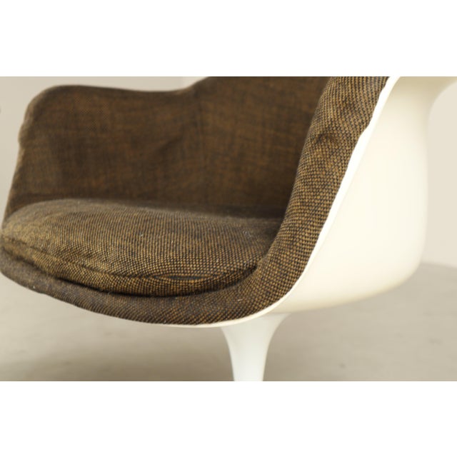 Authentic pair of Tulip armchairs designed by Eero Saarinen and produced by Knoll International in the late 1960s. An...
