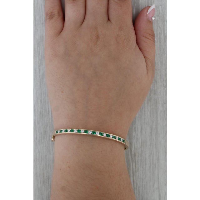 Metal 1990s 1.28ctw Emerald Diamond Bangle Bracelet 14k Yellow Gold 6.75" Hinged For Sale - Image 7 of 7