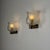 Elegant and atmospheric, this rare pair of wall lights by archimede seguso embodies the poetic refinement of early murano...