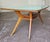Splendid original Italian dining table from the 1950s. Glass top with gold-plated trim. Wooden base with central burl wood...
