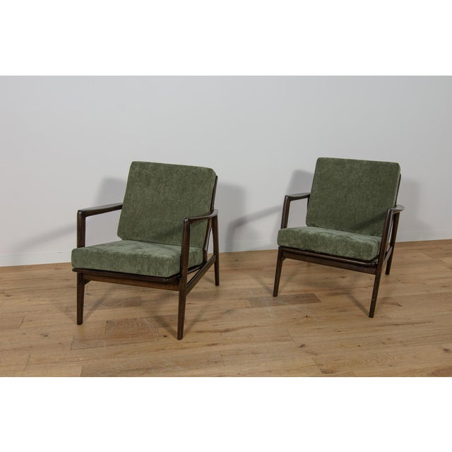 This pair of armchairs was produced by the Polish company Swarzędzka Furniture Factory in 60s.The armchairs have new...