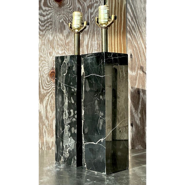 This pair of vintage boho lamps features sleek, solid black marble bases that exude timeless sophistication. The natural...