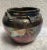 A gorgeous example of hand made Raku pottery, very colorful, and well made. Signed AET.