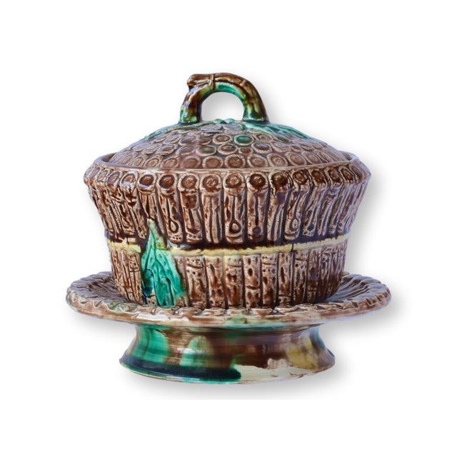 Unusual English majolica covered tureen with an integrated footed base, molded in a detailed basketweave pattern with...