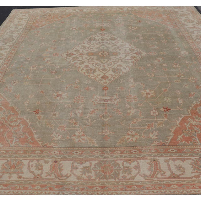 Measures: 13'4 x 16'4 Large Antique Turkish Oushak With Medallion in Green and Pink 13'4 x 16'4. Antique Hand Knotted...