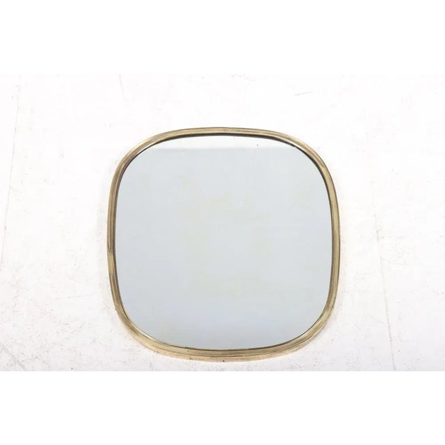Decorative wall mirror in patinated brass designed for Illums Bolighus Denmark in the 1950s. Made in Denmark - great...