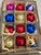 Vintage handblown multicolor striped and solid glass ornaments from Poland in box.
