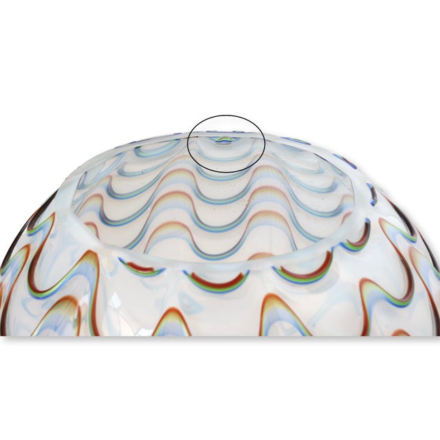 Striking midcentury Murano art glass vase featuring the classic fenicio technique, with undulating colored lines pulled...
