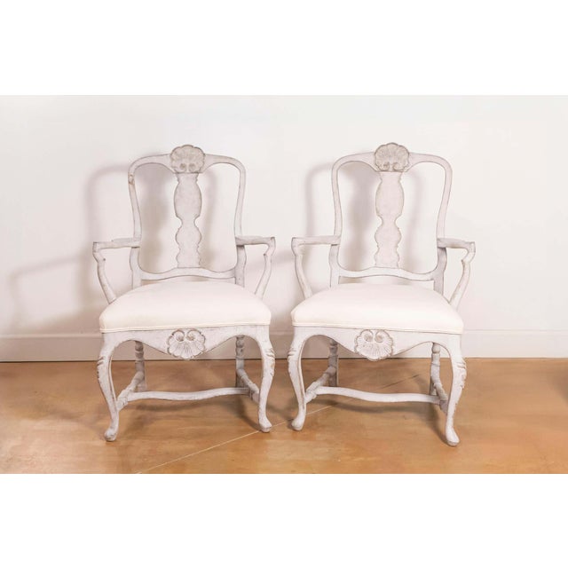 Pair of Scandinavian Rococo style armchairs from the 19th century with new upholstery. Born in Scandinavia during the 19th...