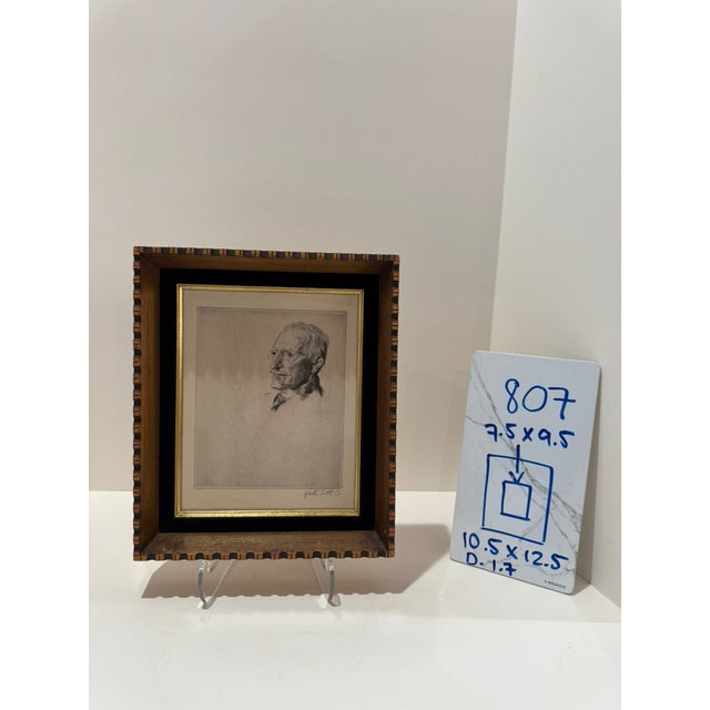 Framed black-and-white portrait print with the artist’s name and “imp.” visible at lower margin. Presented in a deep wood...