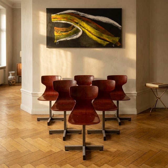 A set of 6 Pagholz chairs featuring a molded pagwood seat and backrest with a distinctive steel star base. This is a mid-...