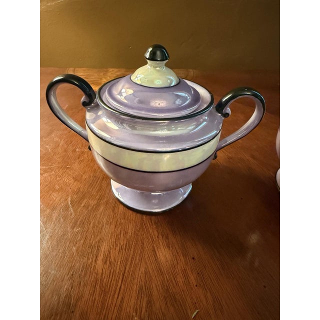 Very good vintage condition, remarkable for its age. This is a complete set including the highly elusive original lidded...