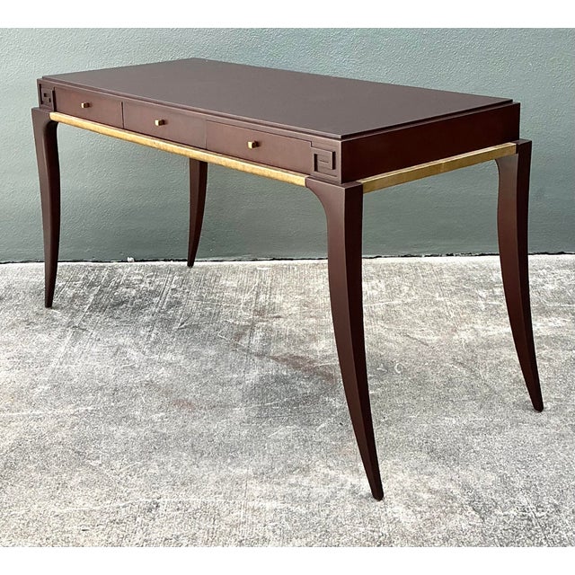 Exude timeless luxury with this exceptional writing desk designed by Thomas Pheasant for the prestigious Baker Furniture....