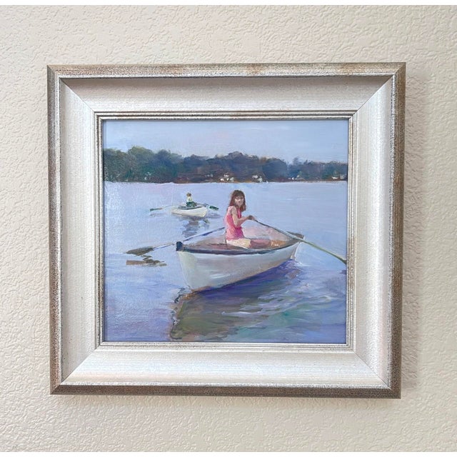 This oil painting captures a serene moment on the water, featuring two figures in small boats gliding across a tranquil...