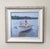 This oil painting captures a serene moment on the water, featuring two figures in small boats gliding across a tranquil...