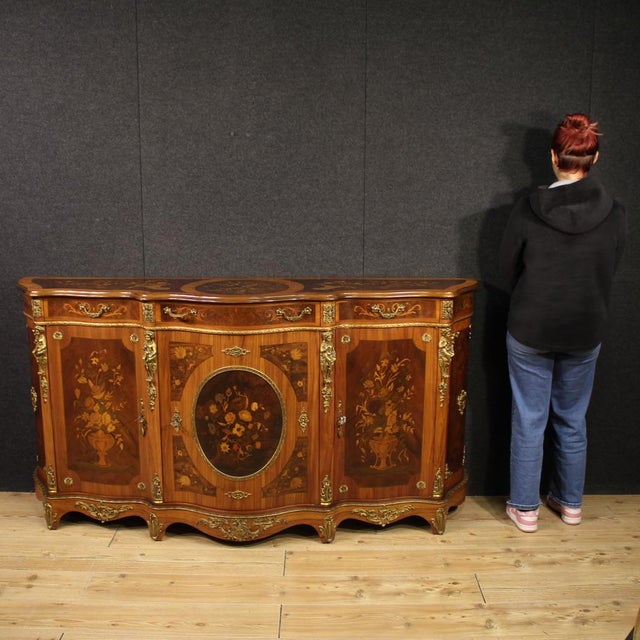 French sideboard from the second half of the 20th century. Richly inlaid with floral decorations furniture in walnut,...