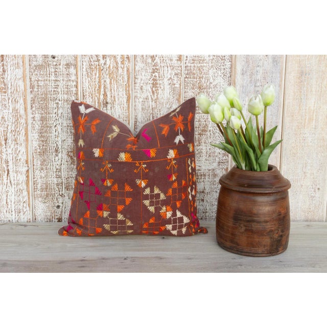 This colorful and luxurious Bagh Phulkari pillow features beautiful hand-done silk embroidery on top of a cotton fabric....
